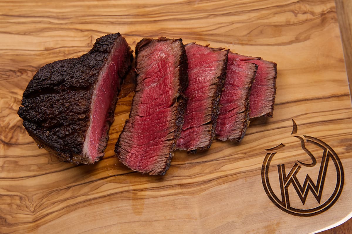 Kingsbury Wagyu Beef Fillet cooked medium rare cut on a chopping board