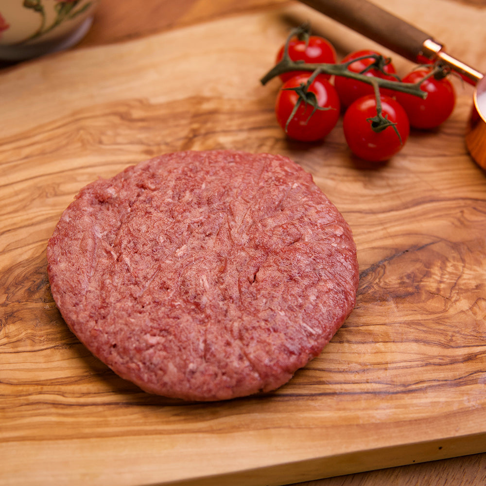 Close up of raw Kingsbury Wagyu Beef Burger on a chopping board