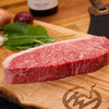 Close up image of Kingsbury Wagyu Beef Sirloin Steak on a chopping board 